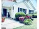 Charming front porch with lush landscaping and a welcoming entrance at 486 Village Cir, Stockbridge, GA 30281