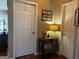 Hallway featuring hardwood floors and modern decorations and lighting at 486 Village Cir, Stockbridge, GA 30281