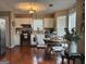 Bright kitchen featuring white cabinets, stainless steel appliances, and a cozy breakfast nook at 486 Village Cir, Stockbridge, GA 30281