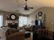 Cozy living room with fireplace, ceiling fan and neutral color palette at 486 Village Cir, Stockbridge, GA 30281