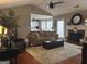 Cozy living room with fireplace and view into the kitchen at 486 Village Cir, Stockbridge, GA 30281