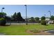 Daytime exterior showing the community tennis courts and clubhouse at 486 Village Cir, Stockbridge, GA 30281