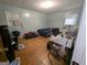 Bedroom features hardwood floors, light-blue walls, a closet, and a window with an AC unit at 1071 Ponderosa Park Dr, Forest Park, GA 30297