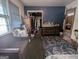 Bedroom featuring carpet, blue walls, a closet, and a window at 1071 Ponderosa Park Dr, Forest Park, GA 30297