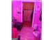 Bedroom with pink lighting, desk, and closet at 1071 Ponderosa Park Dr, Forest Park, GA 30297