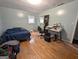 Primary bedroom featuring hardwood floors, light-blue walls, a closet, and a window at 1071 Ponderosa Park Dr, Forest Park, GA 30297