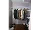 Walk-in closet with clothes hanging and shoe storage at 1071 Ponderosa Park Dr, Forest Park, GA 30297