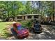 Charming single-story home with a well-maintained lawn and driveway at 1071 Ponderosa Park Dr, Forest Park, GA 30297