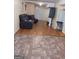 Basement living room with hardwood flooring and comfortable leather couches at 1071 Ponderosa Park Dr, Forest Park, GA 30297