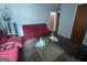 Bright living room featuring a red sofa and modern decorations at 1071 Ponderosa Park Dr, Forest Park, GA 30297