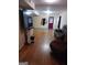 Basement living room with hardwood flooring and comfortable leather couches at 1071 Ponderosa Park Dr, Forest Park, GA 30297