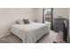 Bedroom with a bed, dresser, and a window providing natural light at 168 Warbler Way, Mcdonough, GA 30253