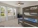 Bedroom with a wooden bunk bed, dresser, and windows providing natural light at 168 Warbler Way, Mcdonough, GA 30253