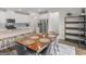 Dining room features a large wood table, seating for six, and connects to the kitchen and dining area at 168 Warbler Way, Mcdonough, GA 30253