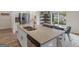 Beautiful kitchen with granite island and stainless steel appliances, adjacent to the dining area at 168 Warbler Way, Mcdonough, GA 30253
