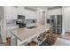Spacious kitchen with a large island, granite countertops, stainless steel appliances, and breakfast bar seating at 168 Warbler Way, Mcdonough, GA 30253