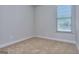 Bright bedroom with neutral carpet, showcasing a peaceful space with a window and ample natural light at 6120 Ripple Way # 46, South Fulton, GA 30349