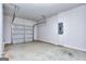 Spacious two car garage with painted walls and concrete floor at 6120 Ripple Way # 46, South Fulton, GA 30349