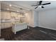Open-concept kitchen featuring an island, pendant lighting, stainless steel appliances, and vinyl flooring at 6120 Ripple Way # 46, South Fulton, GA 30349