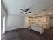 Open layout with island, stainless appliances, granite countertops, pendant lighting and vinyl flooring at 6120 Ripple Way # 46, South Fulton, GA 30349