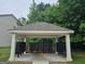 Exterior shot of mailboxes in covered structure with landscaping at 6120 Ripple Way # 46, South Fulton, GA 30349
