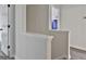 Upstairs hallway showcasing neutral walls and hardwood floors at 122 Claxton Ct, Jonesboro, GA 30238