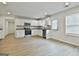 Bright kitchen with white cabinets, granite countertops, and stainless steel appliances at 122 Claxton Ct, Jonesboro, GA 30238