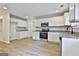 Kitchen featuring white cabinets, granite countertops, and stainless steel appliances at 122 Claxton Ct, Jonesboro, GA 30238