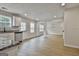 Bright open kitchen featuring stainless steel appliances, granite countertops, and hardwood floors at 122 Claxton Ct, Jonesboro, GA 30238