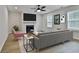 Cozy living room with fireplace, ceiling fan, neutral paint, and comfortable furniture at 122 Claxton Ct, Jonesboro, GA 30238