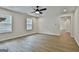 Large living room with ample natural light and sleek wood-style flooring at 122 Claxton Ct, Jonesboro, GA 30238
