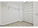 Walk-in closet with ample storage, wire shelving, and wood-look floors at 122 Claxton Ct, Jonesboro, GA 30238