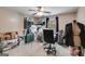 Bright bedroom featuring a ceiling fan, window, and dress form at 7115 Secret Rose, Douglasville, GA 30134