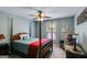 Spacious bedroom with a four-poster bed, window, and decorative accents at 7115 Secret Rose, Douglasville, GA 30134