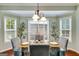 Bright breakfast nook with a glass table, stylish chairs, and ample natural light at 7115 Secret Rose, Douglasville, GA 30134