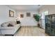 Cozy living room with neutral tones, wood-look floors, and ample natural light at 7115 Secret Rose, Douglasville, GA 30134