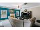 Spacious living room with a fireplace, built-in shelving, and ample seating area at 7115 Secret Rose, Douglasville, GA 30134