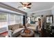 Comfortable living room with hardwood floors, large windows, and open dining space at 7115 Secret Rose, Douglasville, GA 30134