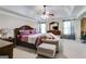 Spacious main bedroom featuring a trey ceiling, ceiling fan, and furniture at 7115 Secret Rose, Douglasville, GA 30134