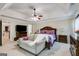 Main bedroom features a trey ceiling, ceiling fan, and a sitting area at 7115 Secret Rose, Douglasville, GA 30134