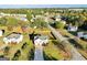 An aerial view of a charming single-Gathering home featuring a well-maintained lawn and a fenced backyard in a neighborhood setting at 5284 Benjamin Trl, Ellenwood, GA 30294