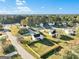 An aerial view of a residential neighborhood featuring a white house with a big fenced backyard at 5284 Benjamin Trl, Ellenwood, GA 30294