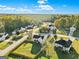 Overhead view of a house with a large fenced yard and lots of trees at 5284 Benjamin Trl, Ellenwood, GA 30294
