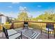 A well-furnished deck offers relaxing outdoor seating with views of the neighborhood and expansive backyard at 5284 Benjamin Trl, Ellenwood, GA 30294