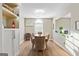 Traditional dining room with seating for eight around a light wood table at 5284 Benjamin Trl, Ellenwood, GA 30294