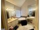 Bright bathroom featuring dual sinks, vanity, tub, and large mirror at 232 Spalding Gates Drive, Atlanta, GA 30328