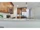 Kitchen featuring stainless appliances, custom cabinets, light countertops, and tile backsplash at 232 Spalding Gates Drive, Atlanta, GA 30328