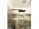 Modern shower featuring rainfall shower head and tiled surround at 232 Spalding Gates Drive, Atlanta, GA 30328