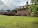Beautifully maintained backyard featuring a spacious deck and a well-manicured lawn at 2451 Old Salem Se Cir, Conyers, GA 30013