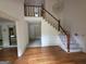 Spacious foyer with hardwood floors, staircase, and chandelier at 2451 Old Salem Se Cir, Conyers, GA 30013
